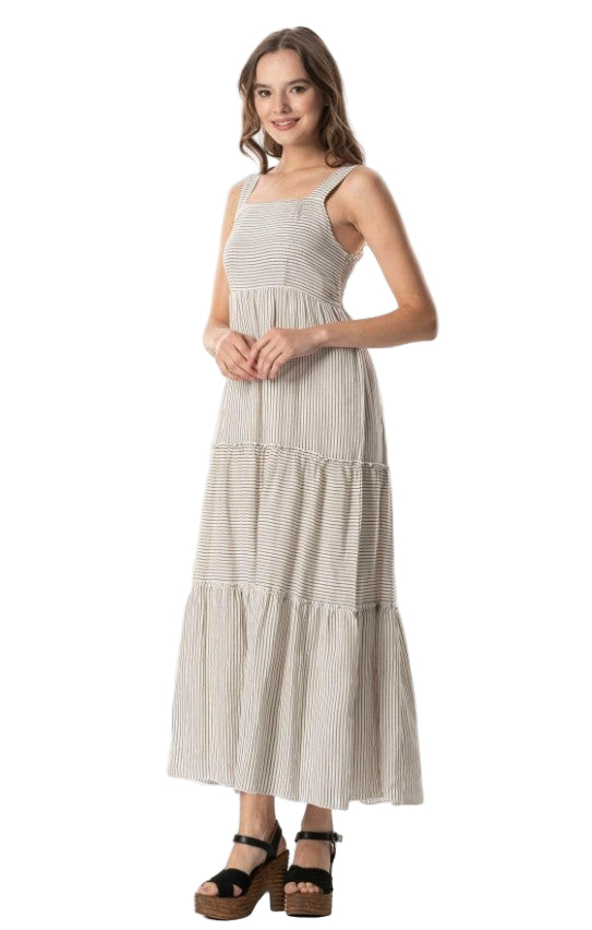 Woman wearing a striped dress on a white background